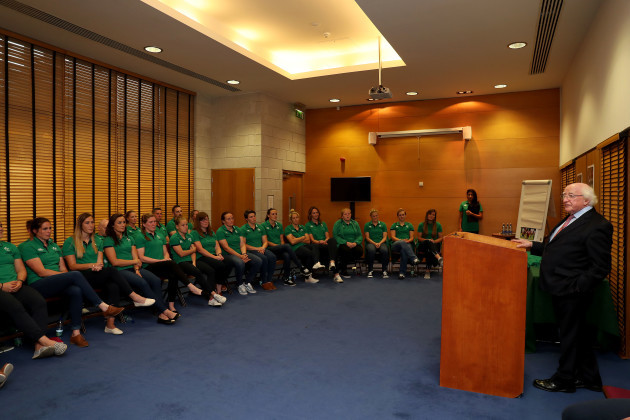 President of Ireland Michael D. Higgins talks to the players before presenting the jersey's