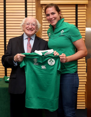 President of Ireland Michael D. Higgins presents a jersey to Nora Stapleton