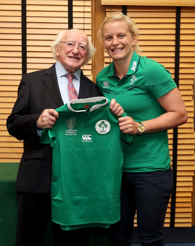 President of Ireland Michael D. Higgins presents a jersey to Claire Molloy