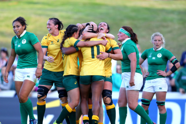 Mahalia Murphy celebrates scoring their first try with teammates