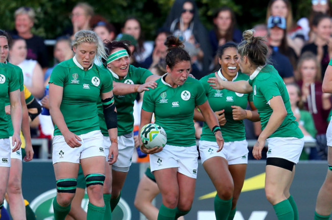 Larissa Muldoon celebrates scoring their first try with teammates