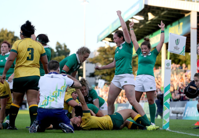 Sophie Spence scores their third try as Nora Stapleton and Larissa Muldoon celebrate