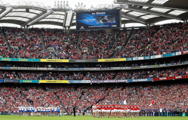 Two teams stand for a minutes silence in memory of the late Tony Keady