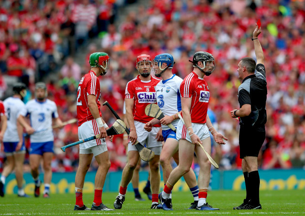 James Owens issues Damien Cahalane with a red card following a second yellow card