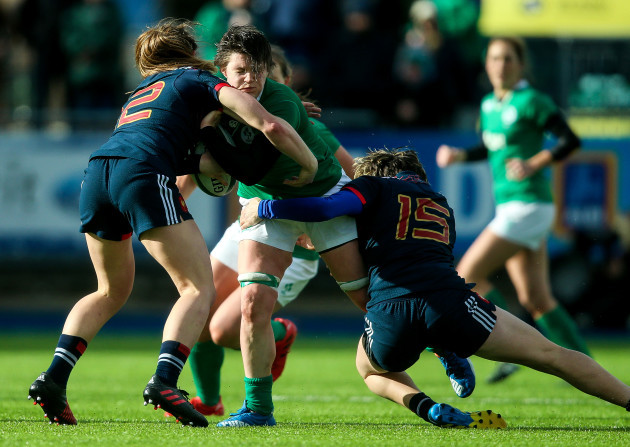 Ciara Griffin is tackled by Elodie Poublan and Jessy Tremouliere