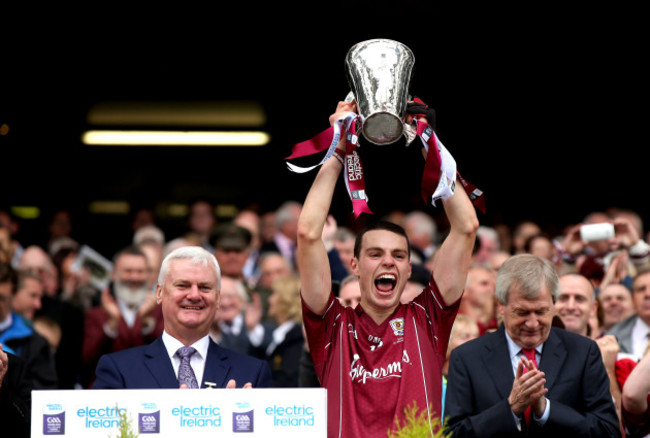 Sean Loftus lifts the trophy