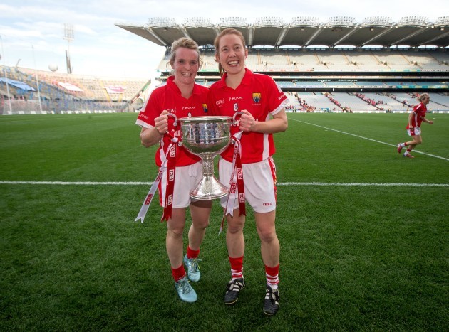 Briege Corkery and Rena Buckley celebrate with the Brendan Martin Cup