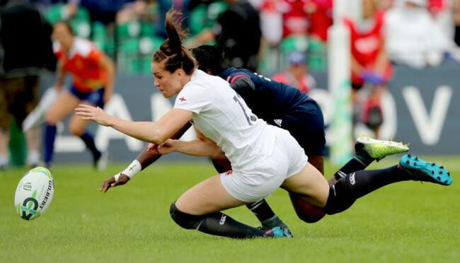 Emily Scarratt scores her sides opening try despite the efforts of Cheta Emba