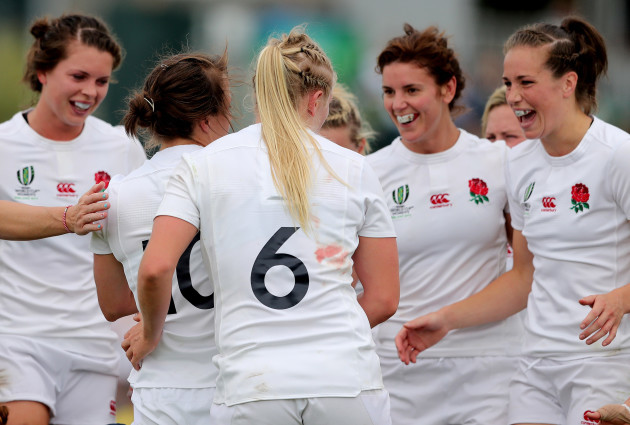 England's players celebrate with try scorer Katy Mclean