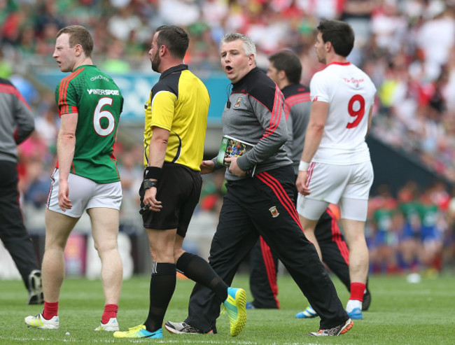 Stephen Rochford tries to speak to referee David Gough at half time