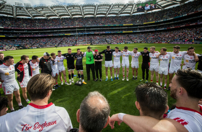 Mickey Harte speaks to his team after the game
