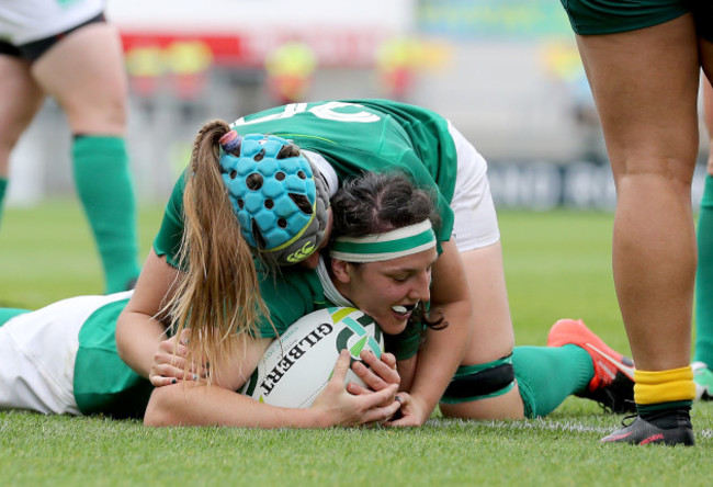 Paula Fitzpatrick scores their fourth try and celebrates with Anna Caplice