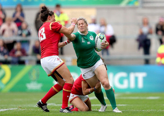 Alison Miller is tackled by Gemma Rowland and Jasmine Joyce