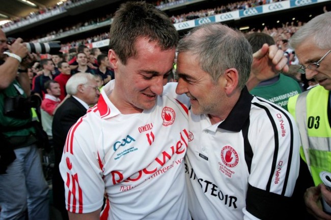 Brian McGuigan and Mickey Harte celebrate