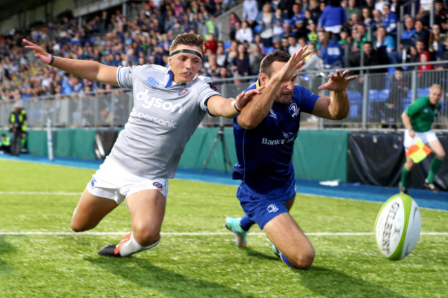 Dave Kearney scores a try despite the efforts of and Darren Atkins