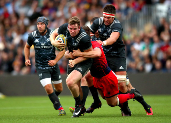 Chris Farrell and Billy Holland tackled by Sam Lewis