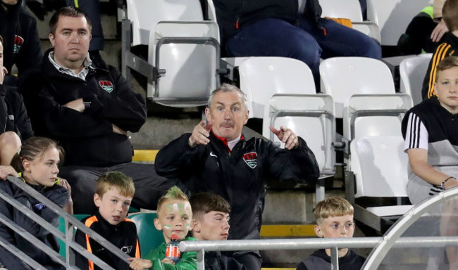 John Caulfield gives instructions to his team from the stand