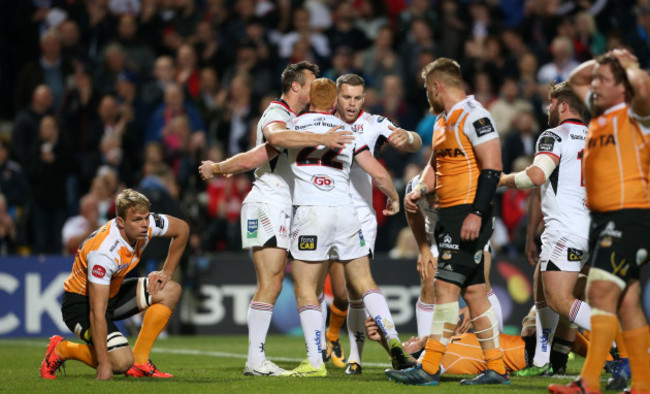 Peter Nelson celebrates his try with Tommy Bowe and Darren Cave