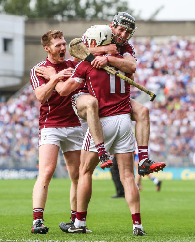 Joe Canning celebrates at the final whistle with Padraic Mannion and John Hansbury