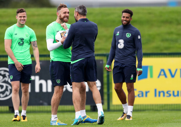 Richard Keogh shares a joke with Jonathan Walters