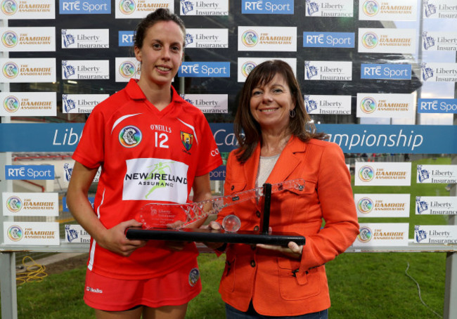 Orla Cotter is presented with the Liberty Insurance player of the match by Deirdre Ashe of Liberty Insurance