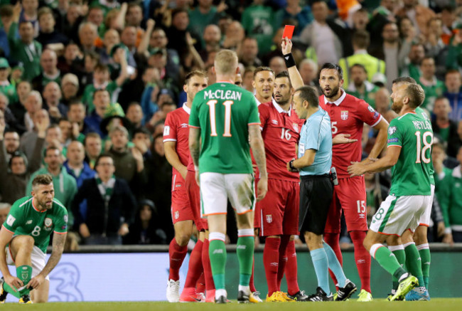 Cuneyt Cakir shows a red card to Nikola Maksimovic