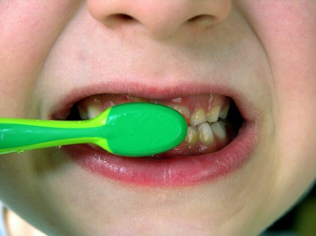 Child brushes his teeth