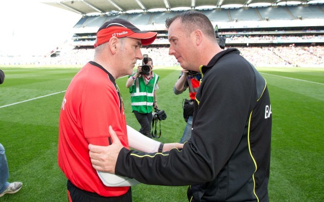 Mickey Harte shakes hands with Niall Carew after the game
