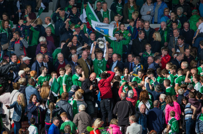 Tom Morrissey lifts the cup