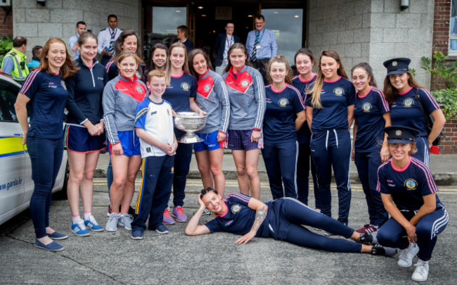 The Cork team arrive at the hospital with the O'Duffy Cup