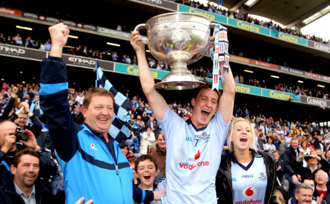 Kevin Nolan lifts the Sam Maguire with fans