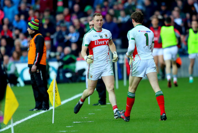 Robert Hennelly leaves the field after being black carded as David Clarke takes to the field