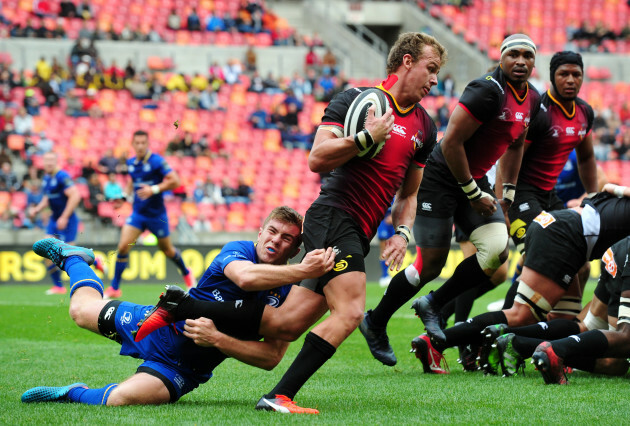 Rudi van Rooyen is tackled by Luke McGrath