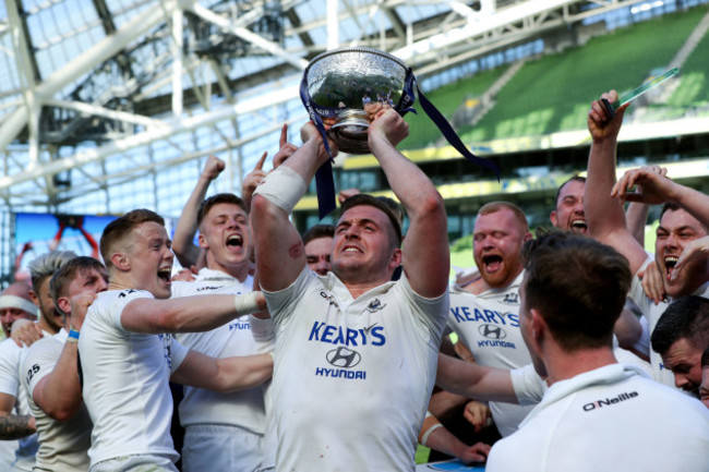 Niall Kenneally celebrates with the league trophy