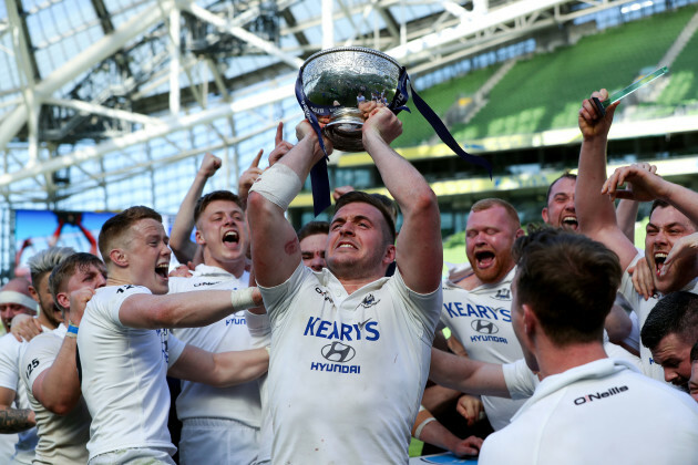 Niall Kenneally celebrates with the league trophy