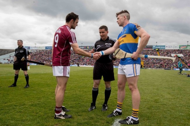 Galway captain David Burke with Tipperary captain Padraic Maher