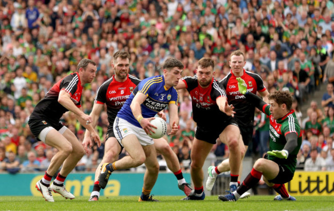 Keith Higgins, Seamus O&rsquo;Shea, Aidan O&rsquo;Shea, David Clarke and Colm Boyle tackle Paul Geaney