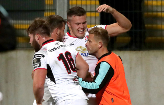 Jacob Stockdale celebrates scoring a try