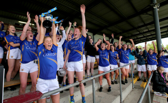 Samantha Lambert lifts the cup