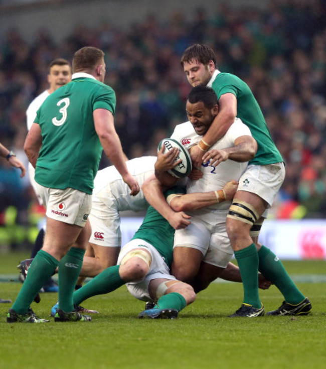 Billy Vunipola is tackled by Iain Henderson and Sean O'Brien