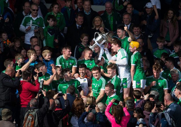 Limerick players celebrate with the cup