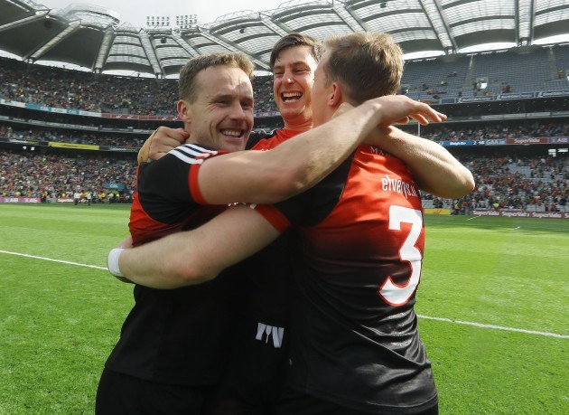Andy Moran celebrates with Barry Moran and Donal Vaughan