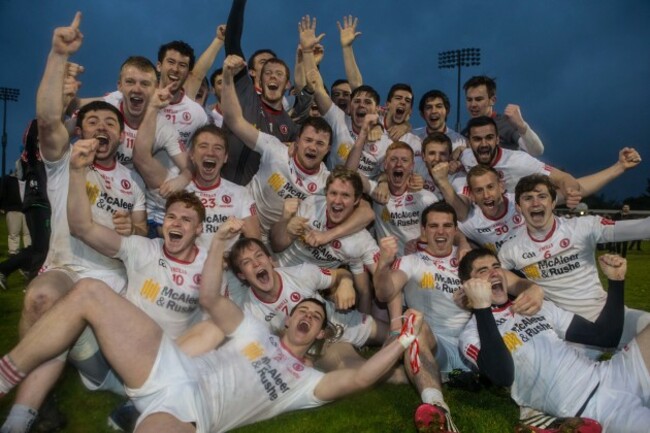 Tyrone players celebrate with the cup