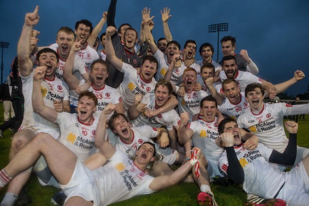 Tyrone players celebrate with the cup