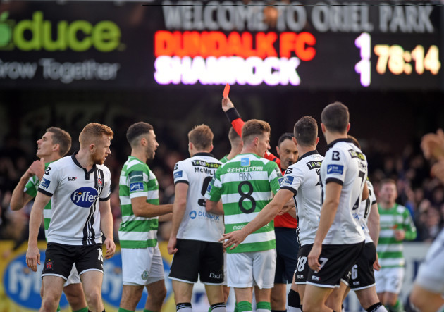 Neil Doyle shows Shamrock Rovers David McAllister a red card