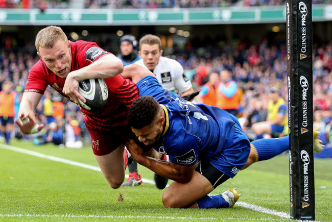 Keith Earls runs in for a try despite the efforts of Adam Byrne