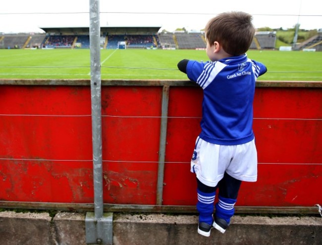 Odhran Graham climbs to see the pitch before the game