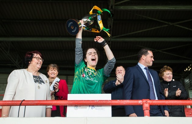 Claire Coffey lifts the trophy