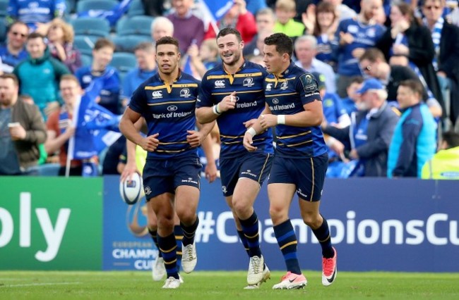 Robbie Henshaw celebrates scoring a try with Noel Reid and Adam Byrne