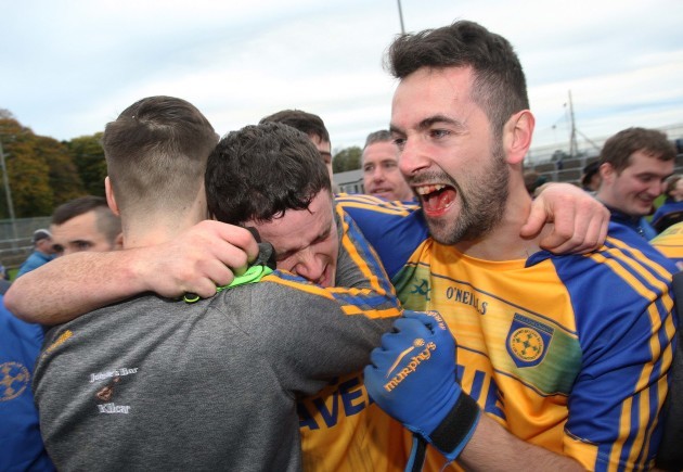 Daniel Lyons, Pauric Carr and Aodhan McGinley celebrate at the final whistle